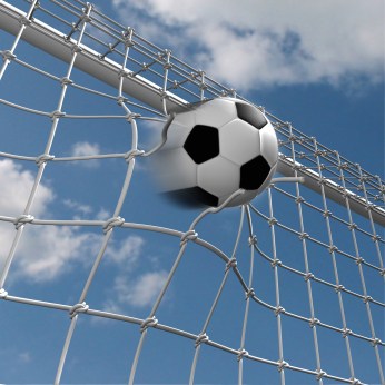 Soccer Ball over blue sky pierces the net