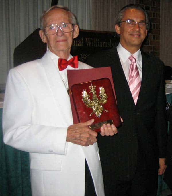 Pictured L-R:  Marion Winters receives Amicus Poloniae award from Counselor Mariusz M. Brymora