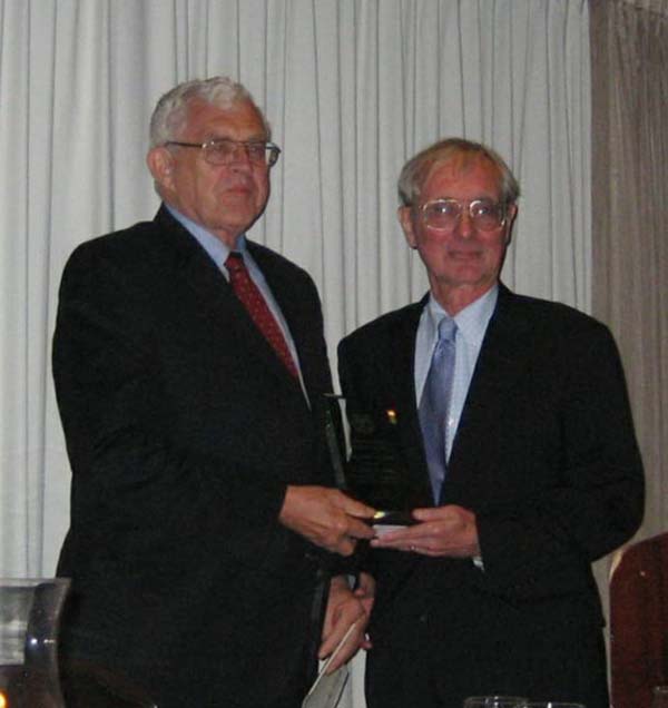 Pictured L-R:  Dr. Charles F. Merbs receiving Distinguished Service Award from Pres. Ted Mirecki 